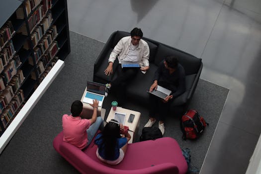 students using laptops in a study group