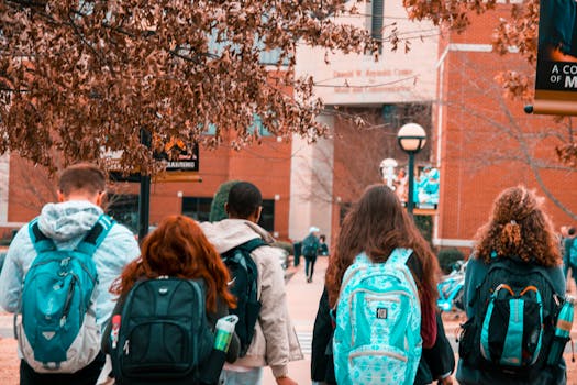 group of students doing yoga on campus