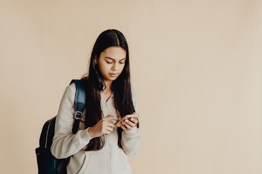 student studying with an app on their phone